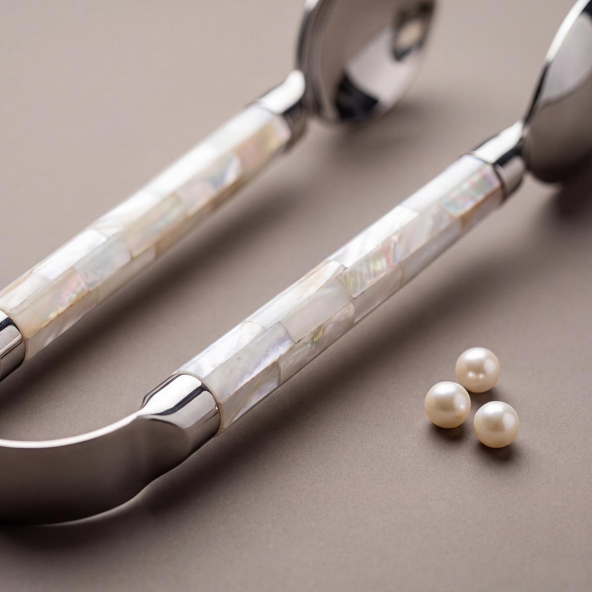 White mother-of-pearl pastry tong